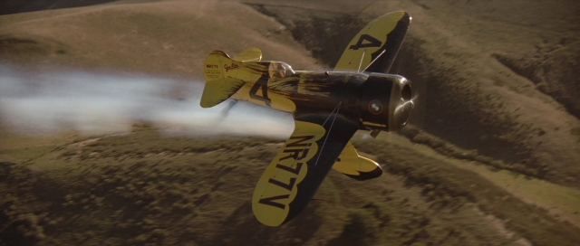 Frame from The Rocketeer — smoke, airplane