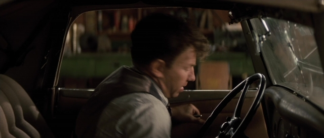 Wide shot frame from The Rocketeer — sitting, car, wheel
