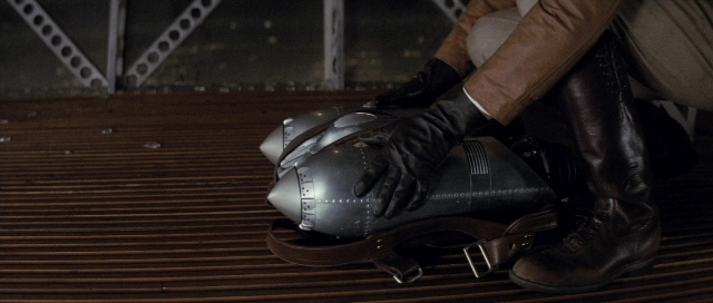 Wide shot frame from The Rocketeer — hat, person, footwear