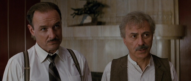 Medium shot frame from The Rocketeer — standing, room, door