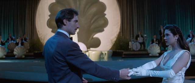 Wide shot frame from The Rocketeer — sitting, suit, tie
