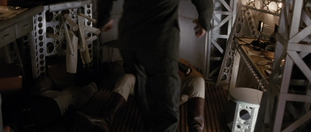 Wide shot frame from The Rocketeer — standing, room, shirt