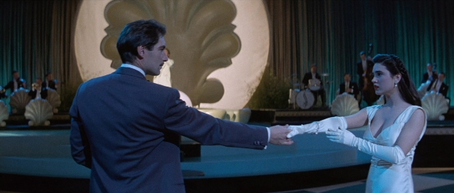 Wide shot frame from The Rocketeer — sitting, suit, tie