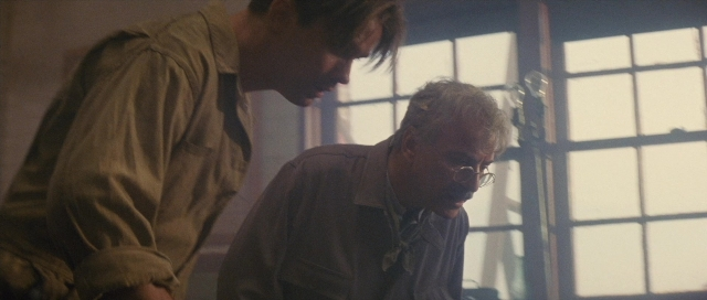 Frame from The Rocketeer — sitting, room, table