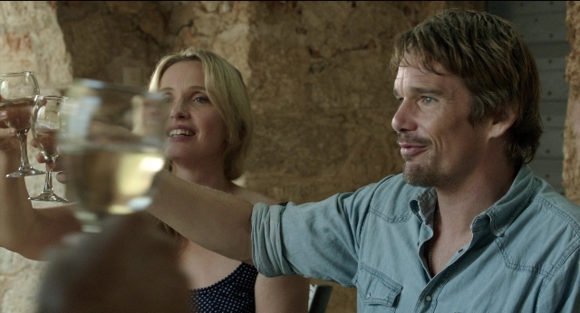 Medium shot frame from Before Midnight — sitting, table, dialogue