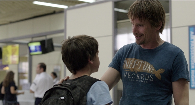 Wide shot frame from Before Midnight — standing, walking, shirt