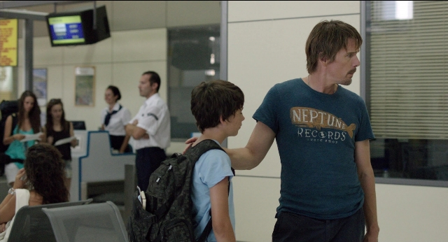 Wide shot frame from Before Midnight — standing, hand, shirt