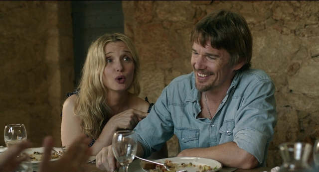 Wide shot frame from Before Midnight — sitting, table, dialogue