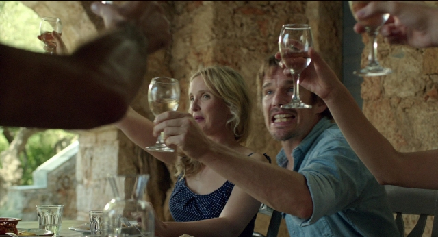 Wide shot frame from Before Midnight — sitting, table, food