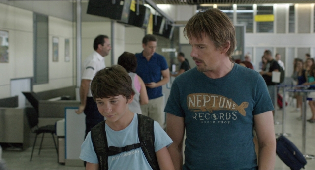 Wide shot frame from Before Midnight — walking, shirt, face