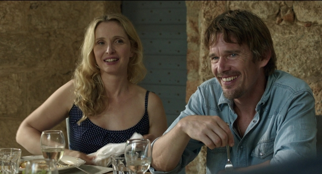 Wide shot frame from Before Midnight — sitting, table, dialogue