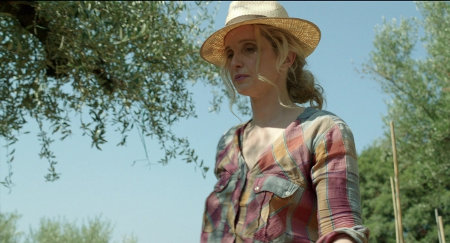 Wide shot frame from Before Midnight — standing, hat, shirt