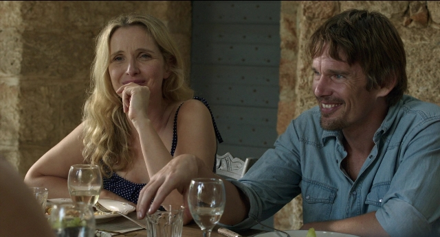 Wide shot frame from Before Midnight — sitting, table, dialogue