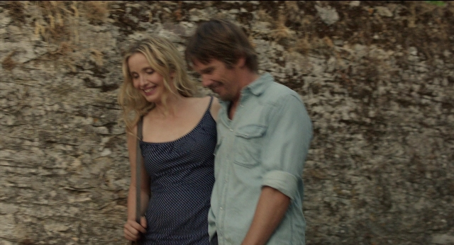Wide shot frame from Before Midnight — standing, dress, shirt