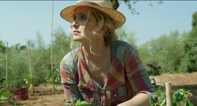 Wide shot frame from Before Midnight — standing, hat, shirt