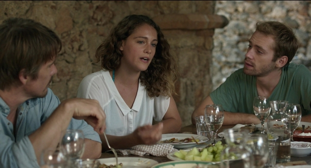 Wide shot frame from Before Midnight — sitting, room, table