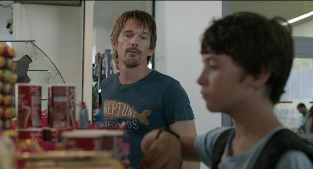 Wide shot frame from Before Midnight — standing, shirt, beard