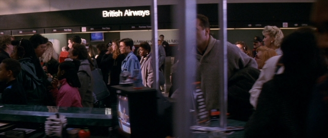 Wide shot frame from Die Hard 2 — standing, person, human face