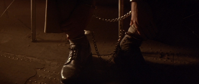 Wide shot frame from Die Hard 2 — standing, footwear