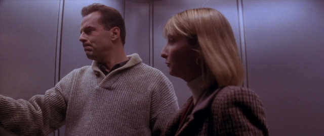 Wide shot frame from Die Hard 2 — standing, face, hair
