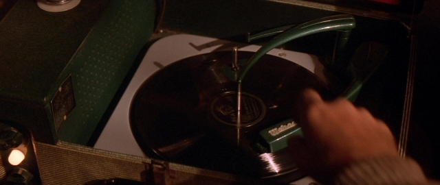 Frame from Die Hard 2 — room, hand, human hand