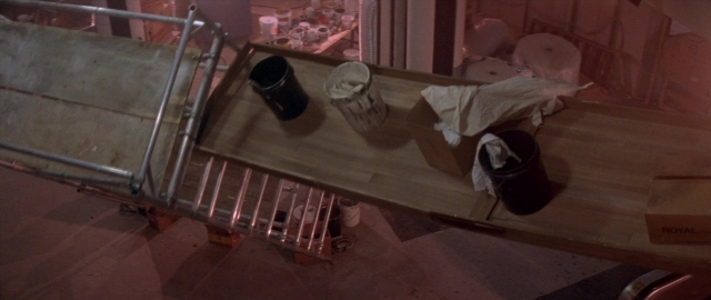 Wide shot frame from Die Hard 2 — room, table, furniture
