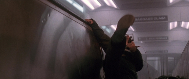 Frame from Die Hard 2 — standing, person, footwear
