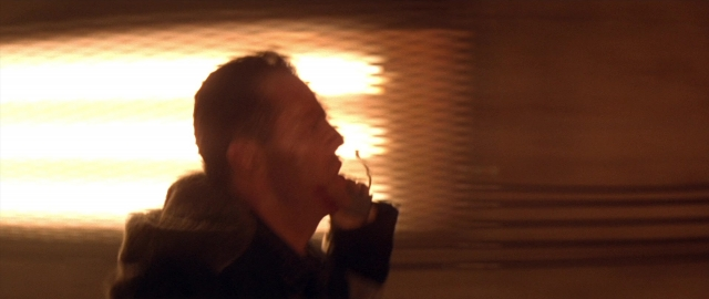 Medium shot frame from Die Hard 2 — hand, beard, face