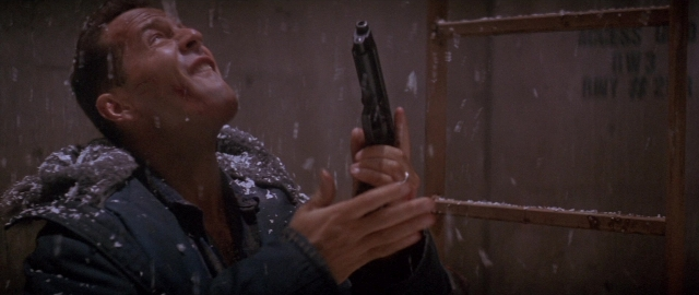 Wide shot frame from Die Hard 2 — standing, room, door