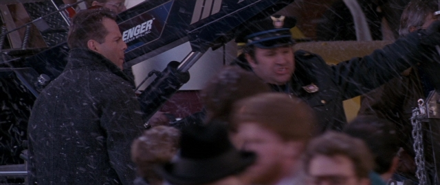 Wide shot frame from Die Hard 2 — standing, dialogue, uniform