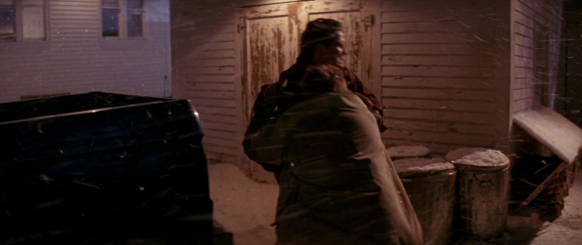 Wide shot frame from Die Hard 2 — standing, room, door