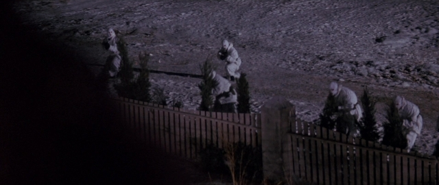 Wide shot frame from Die Hard 2 — standing, walking, animal