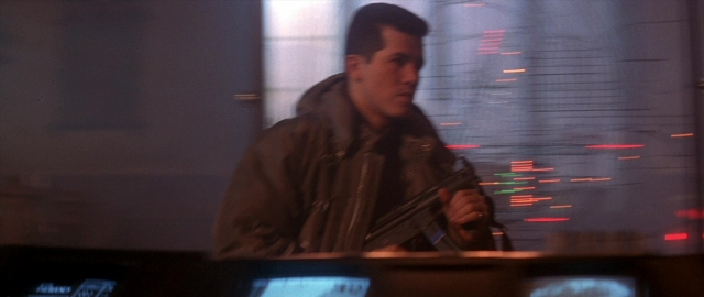 Frame from Die Hard 2 — standing, room, hand