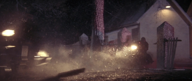 Wide shot frame from Die Hard 2 — standing, street, night