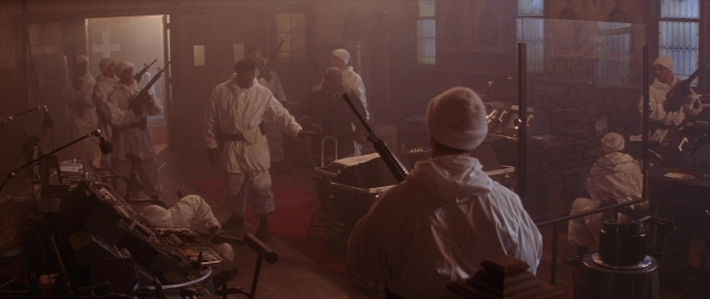 Frame from Die Hard 2 — sitting, standing, room