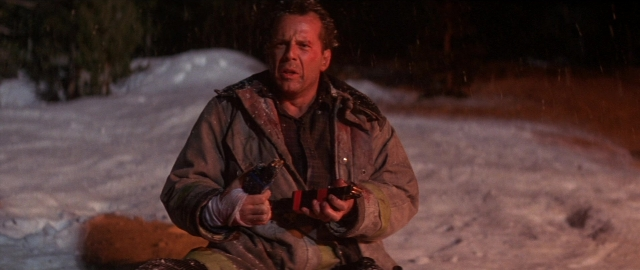 Wide shot frame from Die Hard 2 — sitting, night, snow