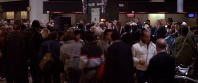 Wide shot frame from Die Hard 2 — standing, night, person