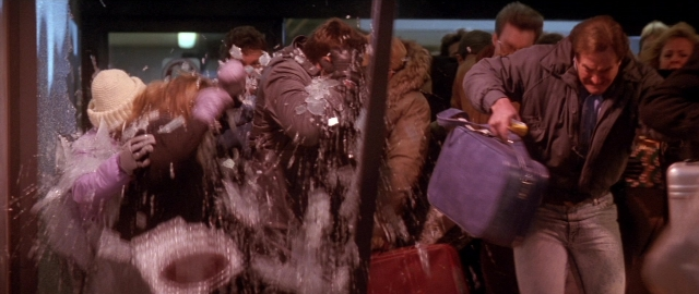 Wide shot frame from Die Hard 2 — night, glass, snow
