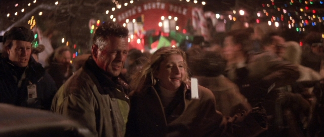 Wide shot frame from Die Hard 2 — standing, dialogue, hat