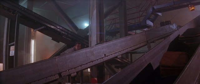 Frame from Die Hard 2 — walking, shirt, person