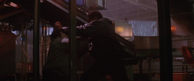 Wide shot frame from Die Hard 2 — fight, person