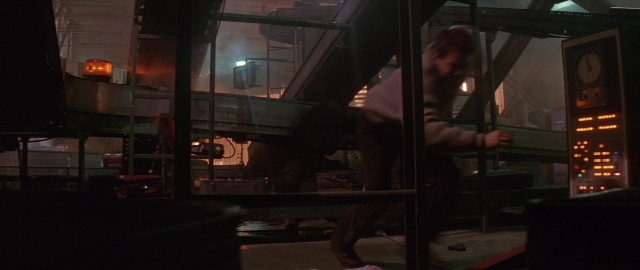 Frame from Die Hard 2 — standing, room, hand