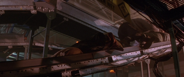 Wide shot frame from Die Hard 2 — shirt, person, running