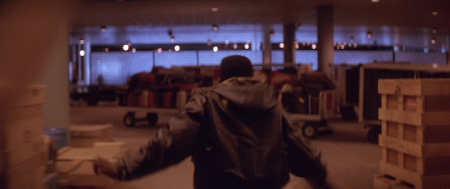 Frame from Die Hard 2 — standing, room, person