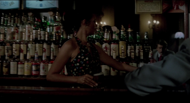 Wide shot frame from The King of Comedy — standing, hand, dress