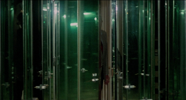 Wide shot frame from The King of Comedy — door, glass