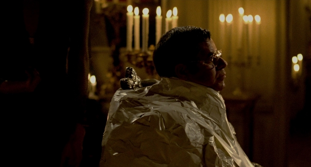 Wide shot frame from The King of Comedy — sitting, person, human face