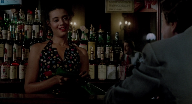 Wide shot frame from The King of Comedy — standing, dialogue, hand