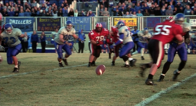 Wide shot frame from The New Guy — football, person, footwear