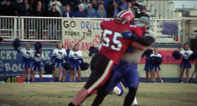 Wide shot frame from The New Guy — person, footwear, sports uniform